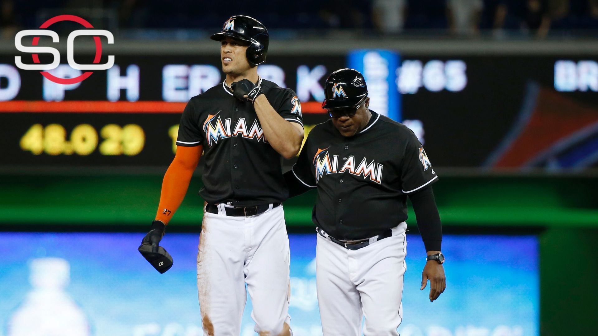 Hit by Pitch, the Miami Marlins' Giancarlo Stanton Is Taken to
