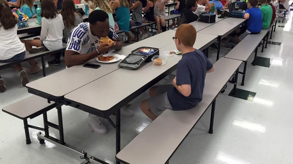 Rudolph eats lunch with student with autism